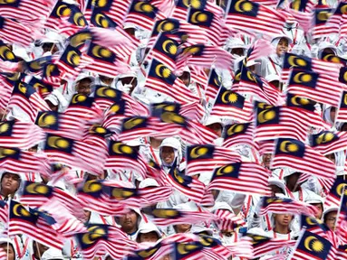 Malaysia merupakan salah satu negara yang menjalankan tradisi mudik menjelang Idul Fitri. Istilah 'mudik' biasa disebut warga Malaysia sebagai 'Balik Kampung'. (AFP PHOTO/ Manan VATSYAYANA)