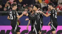 Pemain Arsenal merayakan gol ke gawang Girona dalam pertandingan matchday terakhir league phase Liga Champions 2024/2025 di Montilivi Stadium, Kamis (30/1/2025) dini hari WIB. Arsenal menang 2-1 dalam laga ini. (Josep LAGO / AFP)