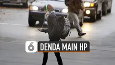 Pejalan kaki yang gunakan telepon seluler saat menyeberang jalan akan didenda Rp141 ribu.
