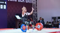 Reaksi Atlet angkat besi (lifter) Indonesia, Eko Yuli Irawan saat bertanding di nomor angkat besi 61kg putra dalam Pesta Olahraga Asia Tenggara (SEA Games) ke-32 di Phnom Penh pada 13 Mei 2023. (AFP/Mohd Rasfan)