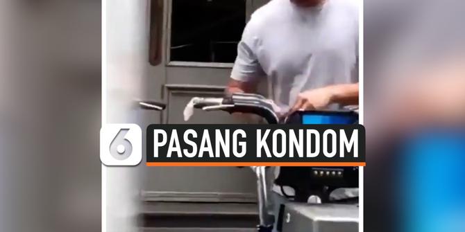 VIDEO: Tak Pakai Masker, Pria ini Justru Pasang Kondom di Stang Sepeda