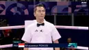 Wasit Indonesia, Muhammad Arisa Putra Pohan saat memimpin pertandingan semifinal tinju Olimpiade Paris 2024 di North Paris Arena, Villepinte, Prancis, Jumat (02/08/2024). (Dok. NOC Indonesia)