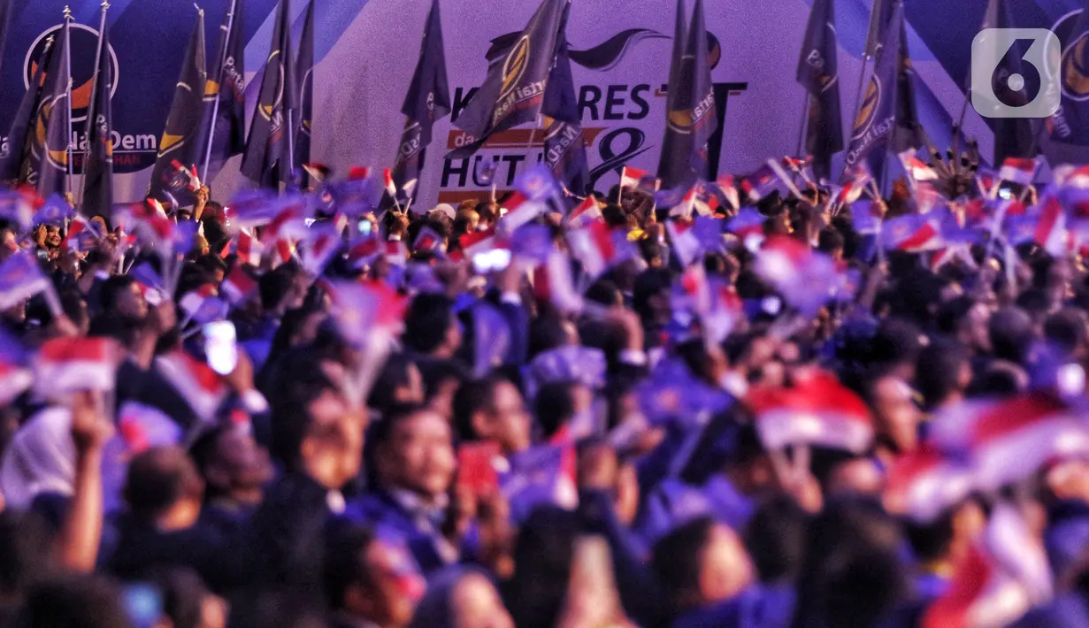 Ribuan kader Partai NasDem saat menghadiri pembukaan Kongres II Partai NasDem di JIExpo, Jakarta, Jumat (8/11/2019). Kongres II Partai NasDem yang digelar 8-11 November mengusung tema Restorasi Untuk Indonesia Maju. (Liputan6.com/Johan Tallo)