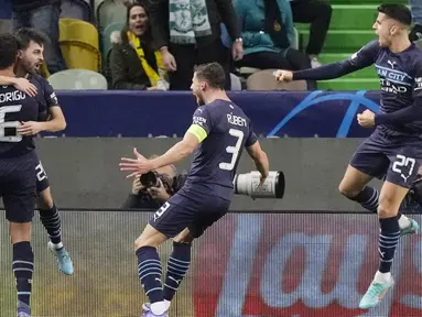 Manchester City tanpa ampun menghajar Sporting Lisbon pada leg pertama babak 16 besar Liga Champions yang digelar di Estadio Jose Alvalade, Rabu (16/2/2022). (AP/Armando Franca)