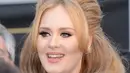 Jika benar Adele akan berpindah dan menetap di London untuk selamanya bersama suami dan anak laki-lakinya, maka tak sedikit penggemarnya yang akan kembali bersedih dan kecewaa setelah konser yang dibatalkan. (AFP/Bintang.com)