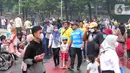 Warga berolahraga saat CFD di kawasan Bundaran HI, Jakarta, Minggu (3/7/2022). Meski sempat diguyur hujan tidak menyurutkan  masyarak untuk berolahraga di akhir pekan. (Liputan6.com/Angga Yuniar)