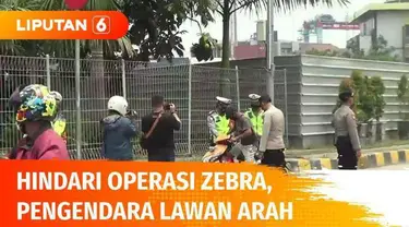 Hari ketiga Operasi Zebra Jaya 2021, pengendara nakal masih terus ditindak oleh polisi lalu lintas. Di jalan raya Daan Mogot, Kalideres, Jakarta Barat, lagi-lagi pengendara sepeda motor yang melintas di jalur Busway, demi menghindari tangkapan polisi...