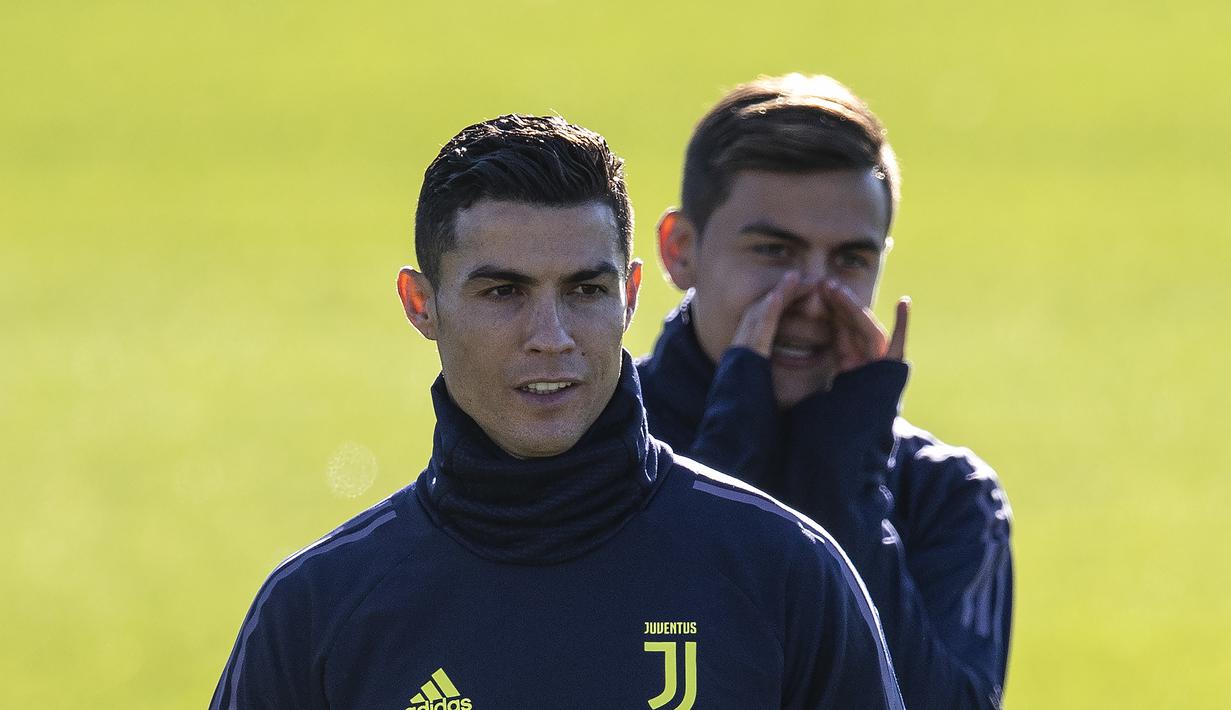 Ekspresi Ronaldo saat melakukan latihan jelang laga lanjutan grup H Liga Champions yang berlangsung di stadion Stade de Suisse, kamis (13/12). Juventus akan berhadapan dengan tuan rumah Young Boys. (AFP/Marco Bertorello)