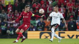 Meski gagal menang karena mendapat perlawanan sengit dari sang tamu namun The Reds tetap lolos ke semifinal Liga Champions. (AP/Jon Super)