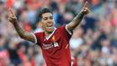 Pemain Liverpool, Roberto Firmino merayakan golnya ke gawang AFC Bournemouth pada lanjutan Premier League di Anfield stadium, Liverpool,(14/4/2018). Liverpool menang 3-0.  (AFP/Lindsey Parnaby)