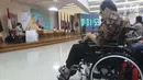 Komunitas Disabilitas mengikuti debat tim sukses Capres/Cawapres di Jakarta, Kamis (28/2). Debat diselenggarakan Pokja Implementasi UU Penyandang Disabilitas, bertema Membangun Indonesia Inklusif Disabilitas 2024. (Liputan6.com/Helmi Fithriansyah)