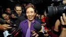 Menteri Susi Pudjiastuti yang mengenakan pakaian serba ungu itu tampak didampingi sejumlah ajudannya, Jakarta, Rabu (3/12/2014). (Liputan6.com/Miftahul Hayat)