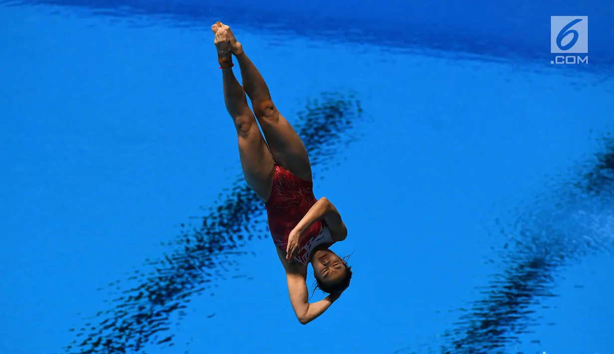 Atlet loncat indah saat tampil di final springboard 1m putri Asian Games 2018, Aquatic Centre, GBK, Jakarta, Jumat (31/8). Nomor ini dimenangkan oleh Wang Han asal China yang berhasil mendapatkan total skor 323.55. (Merdeka.com/Imam Buhori)
