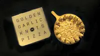 Demam emas. Setelah cokelat berlapis emas dan donat berlapis emas, kini ada piza berlapis emas. Semuanya bisa dimakan.