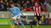 Manchester City berhasil mempermalukan tuan rumah Brentford dengan skor 3-1. (AP Photo/Ian Walton)