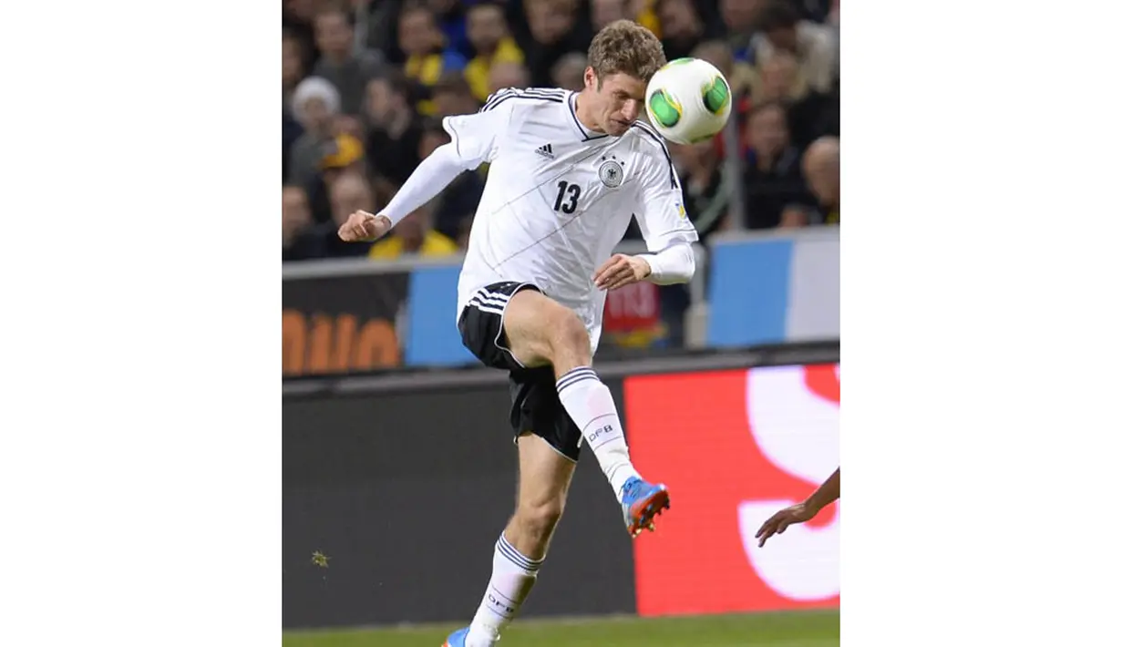 Thomas Muller, pemain sepak bola Jerman yang bermain untuk Bayern München itu hingga kini berhasil mencetak 4 gol di Piala Dunia Brasil 2014. (AFP PHOTO/Jonathan Nackstrand)