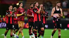 Reaksi para pemain AC Milan setelah pertandingan Liga Europa melawan Benfica di Stadion San Siro, Milan, Kamis (17/9/2026) dini hari WIB. AC Milan kalah 0-2 dari Benfica. (Marco Bertorello/AFP)