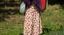 Sebuah orang-orangan sawah ditampilkan selama 'Scarecrows Fair' di Castellar, distrik Provinsi Cuneo, Italia, 10 Mei 2019. Dalam acara tahunan itu, penduduk membuat orang-orangan sawah kreasi mereka sendiri untuk dipajangkan di kebun, halaman, ladang dan persimpangan jalan. (MARCO BERTORELLO/AFP)