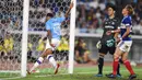 Striker Manchester City, Lukas Nmecha, merayakan gol yang dicetaknya ke gawang Yokohama Marinos pada laga pramusim di Stadion Yokohama, Jepang, Sabtu (27/7). Yokohama kalah 1-3 dari City. (AFP/Charly Triballeau)