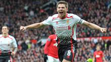 Selebrasi gelandang Liverpool, Steven Gerrard setelah mencetak gol ke gawang Manchester United pada laga Premier League 2013/2014 di Old Trafford Stadium, Manchester (16/3/2014). Steven Gerrard total mencetak 8 gol dan 3 assist selama tampil dalam 30 laga Liverpool kontra Manchester United sepanjang sejarah Premier League Liga Inggris. Dua gol terakhirnya ke gawang MU dicetak pada laga pekan ke-30 Premier League 2013/2014 saat Liverpool menang 3-0. (AFP/Paul Ellis)