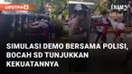 Simulasi demo anggota kepolisian bersama bocah-bocah SD mengundang perhatian