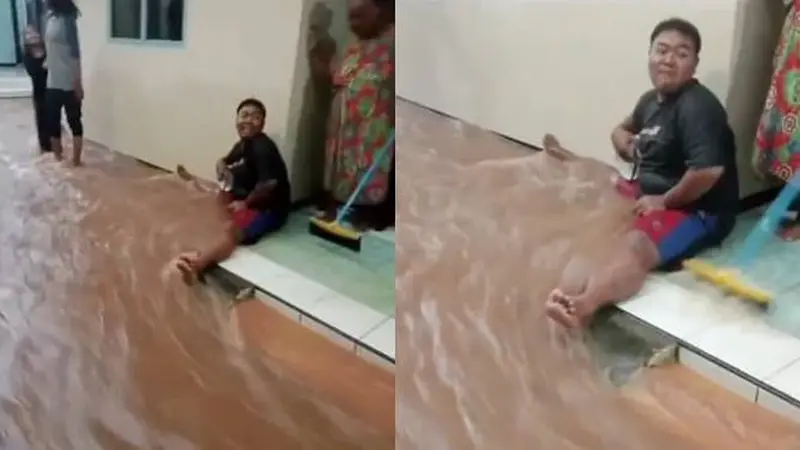 Kocak Cara Orang Halau Aliran Banjir di Depan Rumah, Netizen: Tanggul Hidup