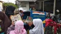 Kisah Wahyudi Pegiat Literasi yang Sempat Lumpuh Saat Campaign Free Cargo Literacy (Dewi Divianta/Liputan6.com)