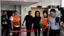 Selasa (4/11/2014), Romi Herton dan Masyito menjalani pemeriksaan untuk melengkapi berkas, Jakarta. (Liputan6.com/Miftahul Hayat)