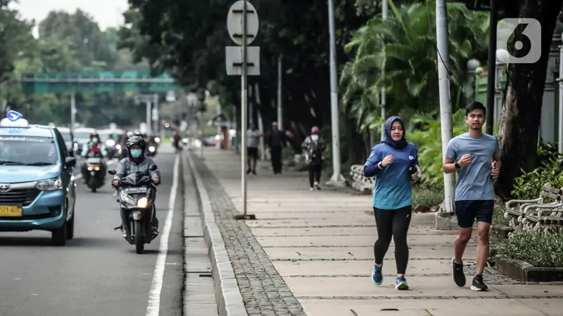 FOTO: Pemerintah Umumkan Pelonggaran Pemakaian Masker di Luar Ruangan