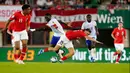 Dua gol Dodi Lukebakio (12', 55') dan Romelu Lukaku (58') hanya bisa dibalas Konrad Laimer (72') serta penalti Marcel Sabitzer (84'). Hasil ini membuat Belgia lolos ke Euro 2024 di Jerman lebih dulu. (AP Photo/Florian Schroetter)