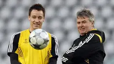 Chelsea's Manager Guus Hiddink with John Terry during the team training session on the eve of the Champions League match between Juventus and Chelsea at Olympic Stadium in Turin on March 9, 2009. AFP PHOTO/Adrian Dennis