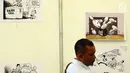 Pengunjung melihat karikatur antikorupsi pada pameran Indonesia International Book Fair (IIBF) 2017 di Jakarta, Jumat (8/9). KPK menampilkan stand yang mengedukasi masyarakat tentang antikorupsi. (Liputan6.com/Helmi Fithriansyah)