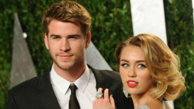 Miley Cyrus dan Liam Hemsworth (AP Photo)