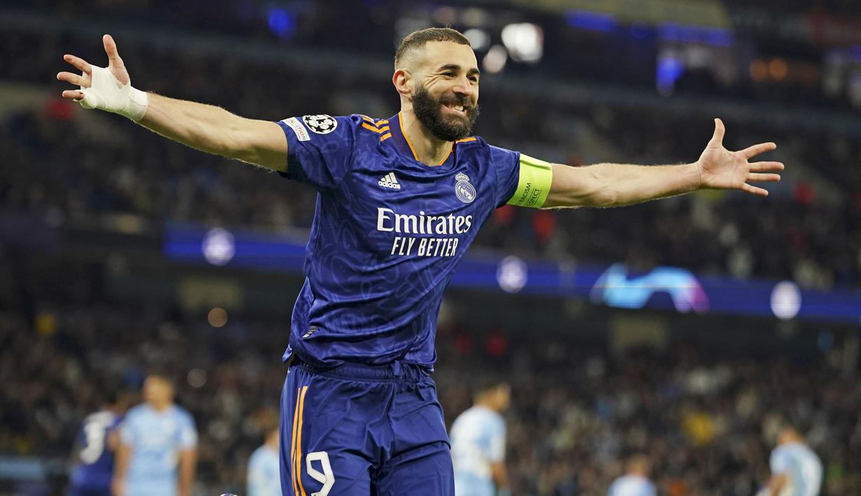 <p>Sementara Real Madrid tiga kali memperkecil kedudukan lewat dua gol Karim Benzema dan Vinicius Junior.&nbsp;(AP/Dave Thompson)</p>