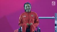 Atlet Para Powerlifting Indonesia, Ni Nengah Widiasih bersiap prosesi medali Womens Up to 41.00kg Asian Para Games 2018 di Jakarta, Minggu (7/10). Ni Nengah meraih perak perdana untuk Indonesia di Asian Para Games 2018. (Liputan6.com/Helmi Fithriansyah)