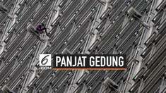 Seorang pria asal Prancis memanjat gedung pencakar langit di Hong Kong. Ia memasang spanduk yang mendorong perdamaian di kota yang tengah diguncang krisis politik itu.