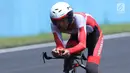 Atlet ParaCycling, M Fadli Immamuddin saat laga di nomor Individual Time Trial C4 Asian Para Games 2018 di Sirkuit Sentul Bogor, Senin (8/10). M Fadli menyelesaikan lima putaran lomba dengan waktu 28 menit 21,835 detik. (Liputan6.com/Helmi Fithriansyah)