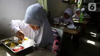 Penyelenggaraan program makan bergizi gratis dilakukan menyesuaikan kesiapan dari wilayah terkait. (Liputan6.com/Herman Zakharia)
