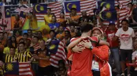 Keberhasilan Owi/Butet meraih emas, turut mengangkat klasemen perolehan mendali Indonesia menjadi terbaik kedua untuk kawasan Asia Tenggara. (AP Photo/Mark Humphrey)