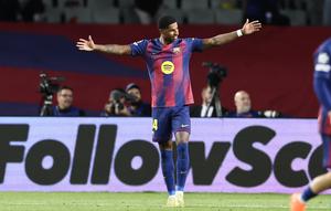 Penyerang Barcelona, Marcus Rashford, berselebrasi setelah mencetak gol ke gawang Olympiakos pada pada laga Liga Champions di Estadi Olimpic Lluis Companys, Rabu (22/10/2025) dini hari WIB. (Josep Lago/AFP)
AFP