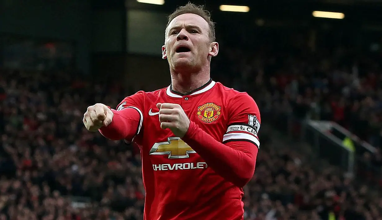 Penyerang Manchester United saat melakukan selebrasi tinju pada pertandinga Liga Inggris. Dikabarkan Aksi tampar Wayney Rooney kepada Briton Wade Barrett semata untuk menaikkan rating WWE sendiri. (Dailymail)