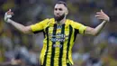 <p>Pemain depan Ittihad asal Prancis bernomor punggung 09, Karim Benzema, merayakan golnya selama pertandingan Liga Pro Saudi antara Al-Ittihad dan Al-Nassr di King Abdullah Sports City di Jeddah pada tanggal 6 Desember 2024. (AFP)</p>