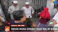 Ribuan warga berebut mendapatkan zakat sebesar Rp 40 ribu dari seorang pengusaha tekstil di Surabaya, Jawa Timur.
