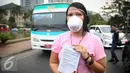 Seorang artis mengunakan masker saat aksi solidaritas #melawanasap di Patung Kuda kawasan Merdeka Barat, Jakarta, Jumat (9/10/2015). Aksi mendesak agar pemerintah segera bertanggung jawabnya untuk menanggulangi kebakaran. (Liputan6.com/Faizal Fanani)