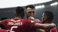 Striker Persija Jakarta, Marko Simic, merayakan gol yang dicetaknya ke gawang Barito Putera pada laga Liga 1 di Stadion Patriot, Jawa Barat, Selasa (30/10). Persija menang 3-0 atas Barito. (Bola.com/Vitalis Yogi Trisna)