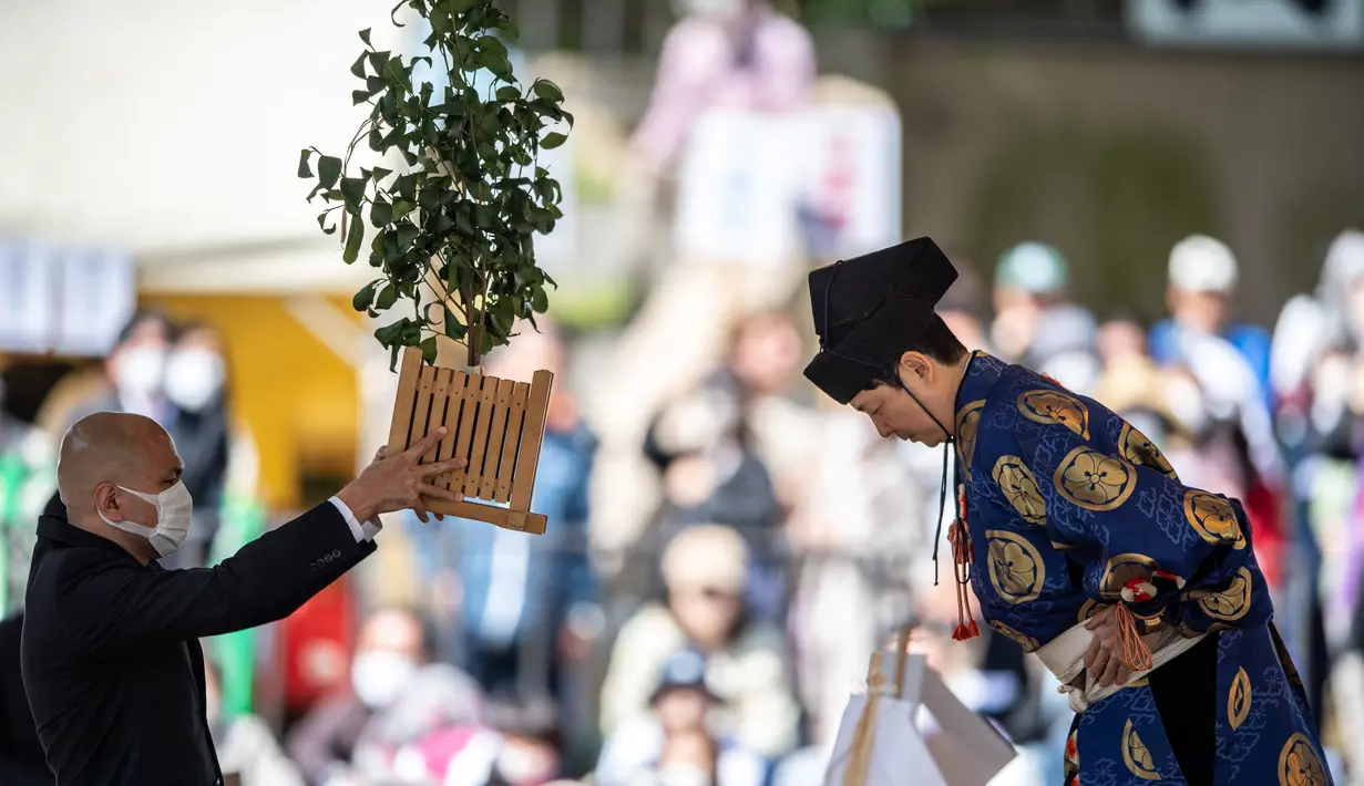 Alasan utama diadakannya acara di Kuil Yasukuni adalah agar pesumo dapat berdoa untuk kemenangan. (AFP/Philip Fong)