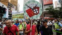 Para aktivis pro-demokrasi Hong Kong melakukan aksi unjuk rasa untuk memrotes kebijakan Beijing yang dianggap represif, 1 Oktober 2018 lalu (AFP)