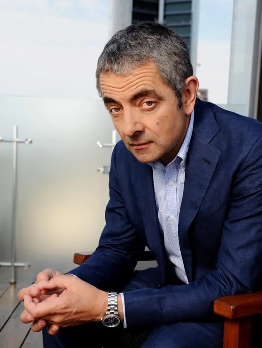 Diketahui jika Rowan Atkinson sama sekali tak menutup-nutupi hubungan asmaranya dengan gadis yang lebih muda 28 tahun darinya tersebut. Hal tersebut jelas membuat sang mantan istri kecewa. (Bintang/EPA)