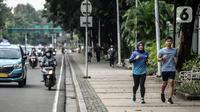 Warga berolahraga di pedestrian kawasan Jalan Thamrin, Jakarta, Selasa (17/5/2022). Presiden Joko Widodo atau Jokowi mengatakan, masyarakat diperbolehkan tidak menggunakan masker jika sedang beraktivitas di luar ruangan atau area terbuka yang tidak padat orang. (Liputan6.com/Faizal Fanani)