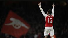 Tahun 2015, merupakan awal momentum Arsenal untuk kembali meraih gelar Liga Premier Inggris. The Gunners yang kini berada di peingkat dua menjadi satu-satunya klub besar yang penampilannya paling stabil musim ini. (AFP/Adrian Dennis)